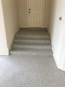 Epoxy coated concrete stair from garage into home